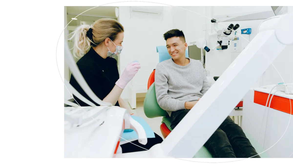 A dentist with a smiling patient